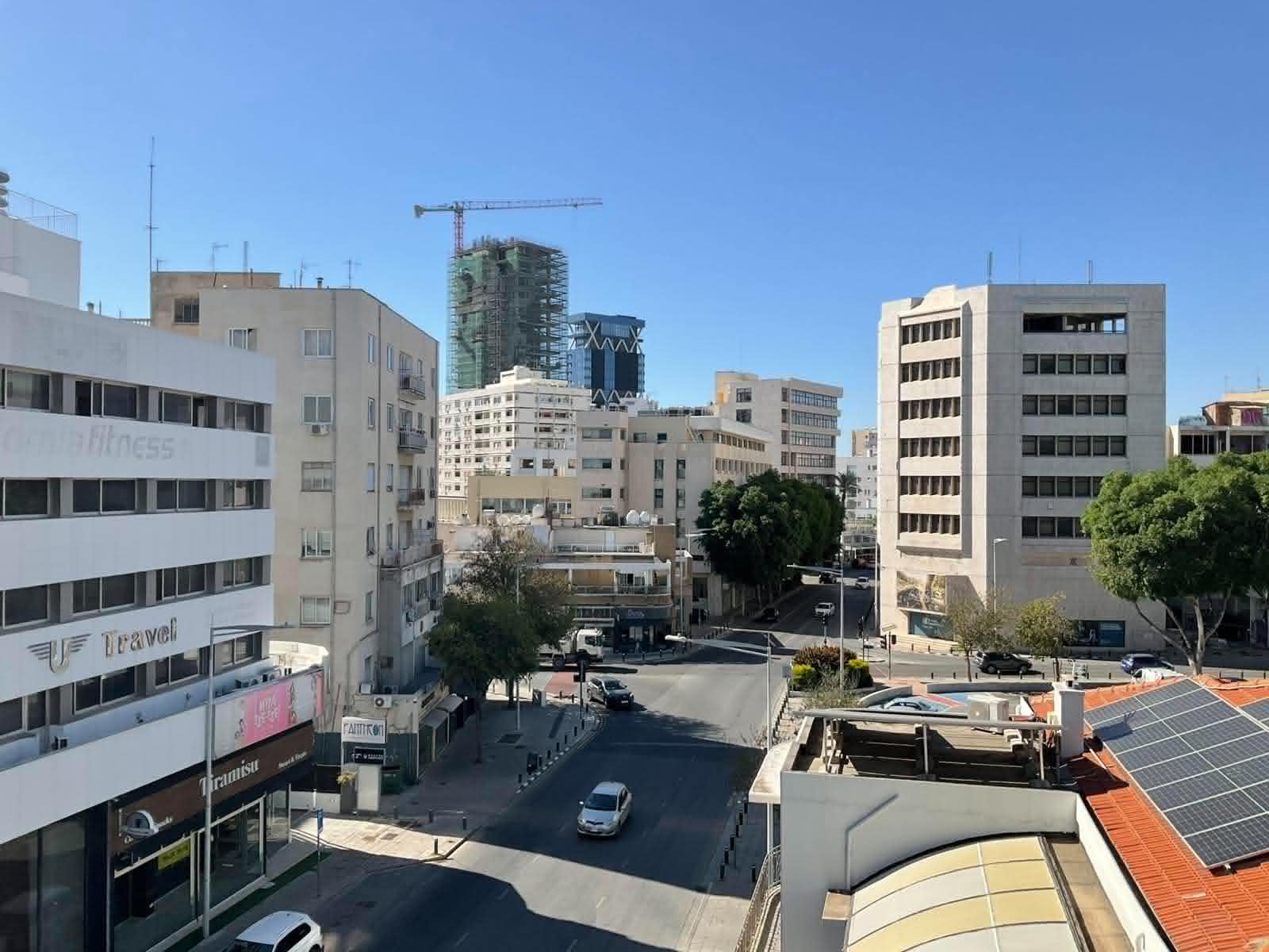 Wide Nicosia city view with skyline and street from the Vintage Central Suite