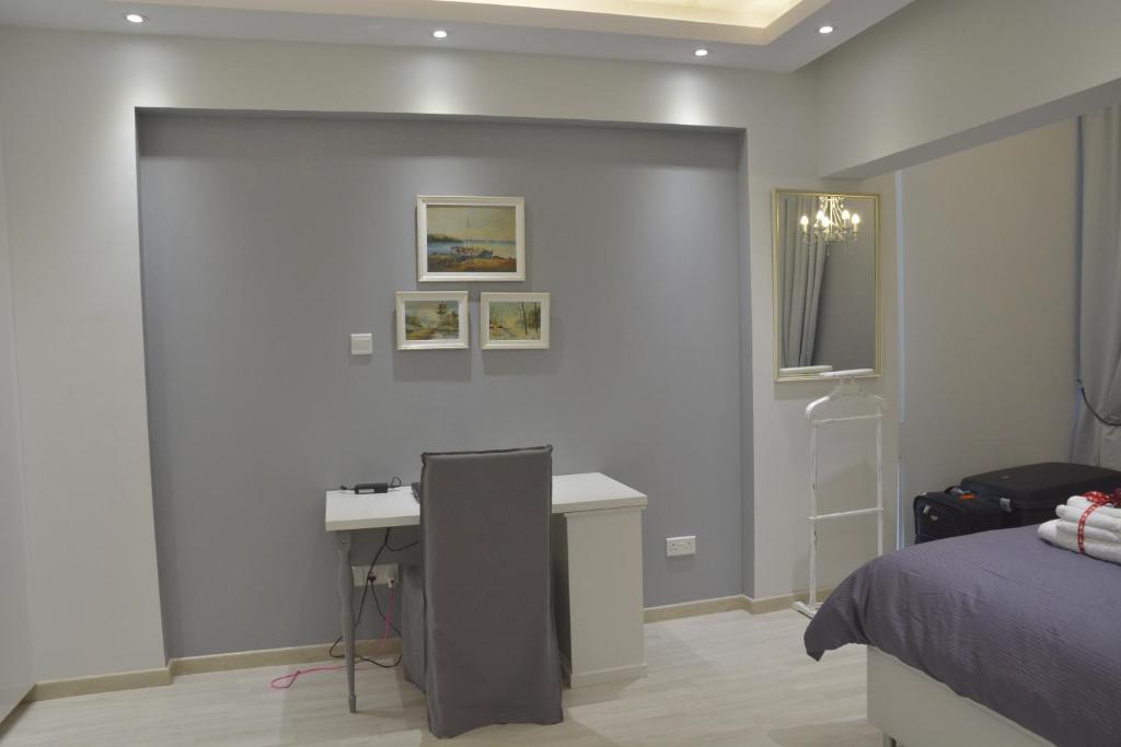 Work desk and framed art in the Armonia Suite bedroom, central Nicosia apartment