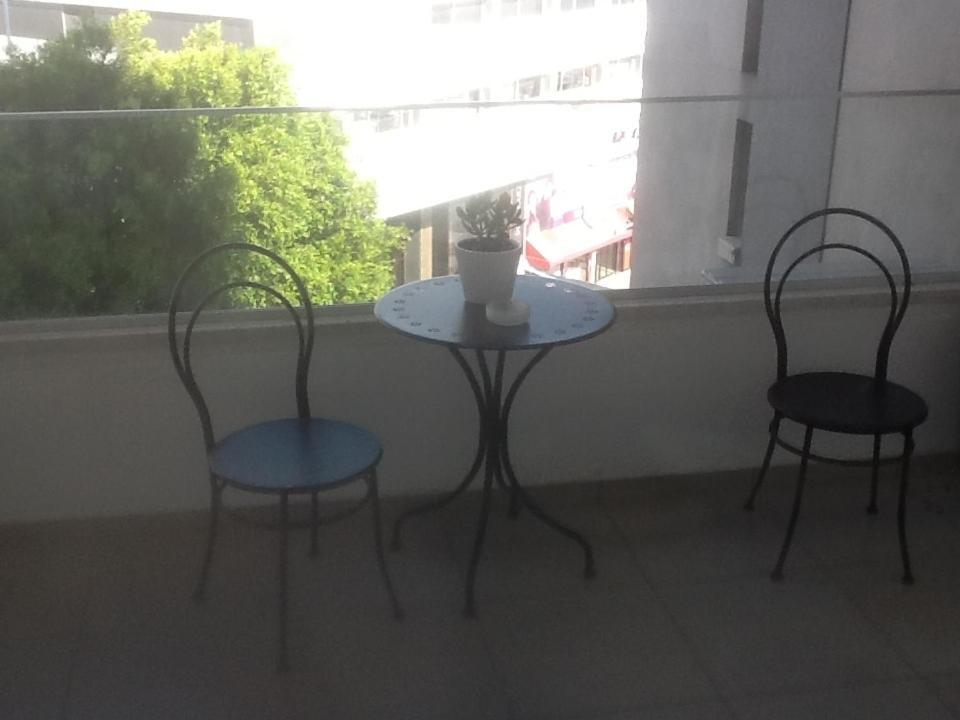 Private balcony with bistro table and chairs at the Vintage Suite in central Nicosia