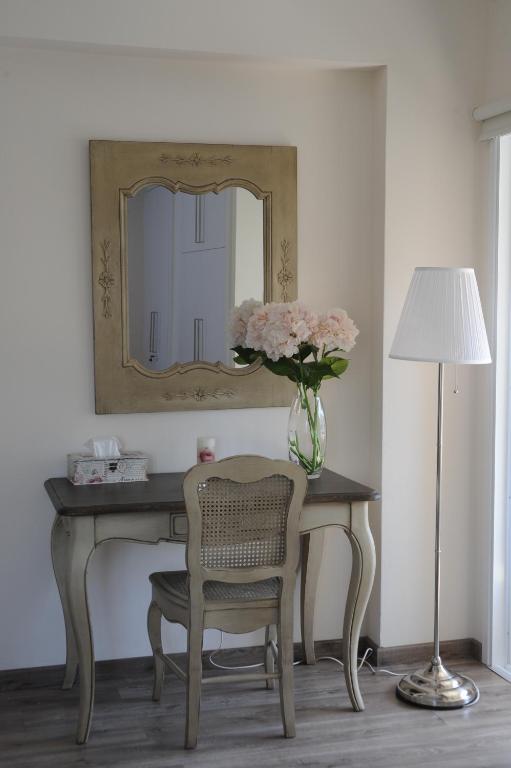 Dressing table with mirror and flowers in the Vintage Suite, central Nicosia apartment