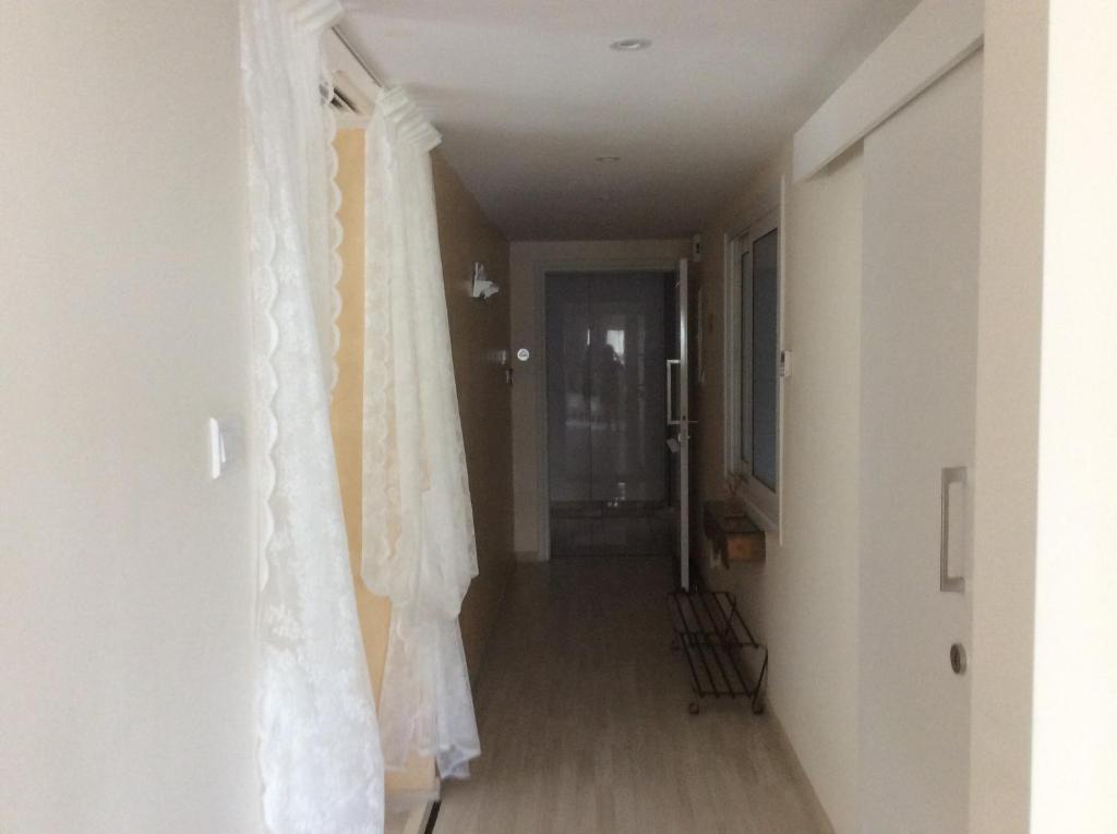 Internal corridor with lace drapes at the Fantasia Central Suite in central Nicosia