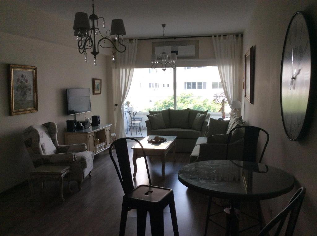Vintage Suite living room with TV, sofa and balcony view in central Nicosia Cyprus