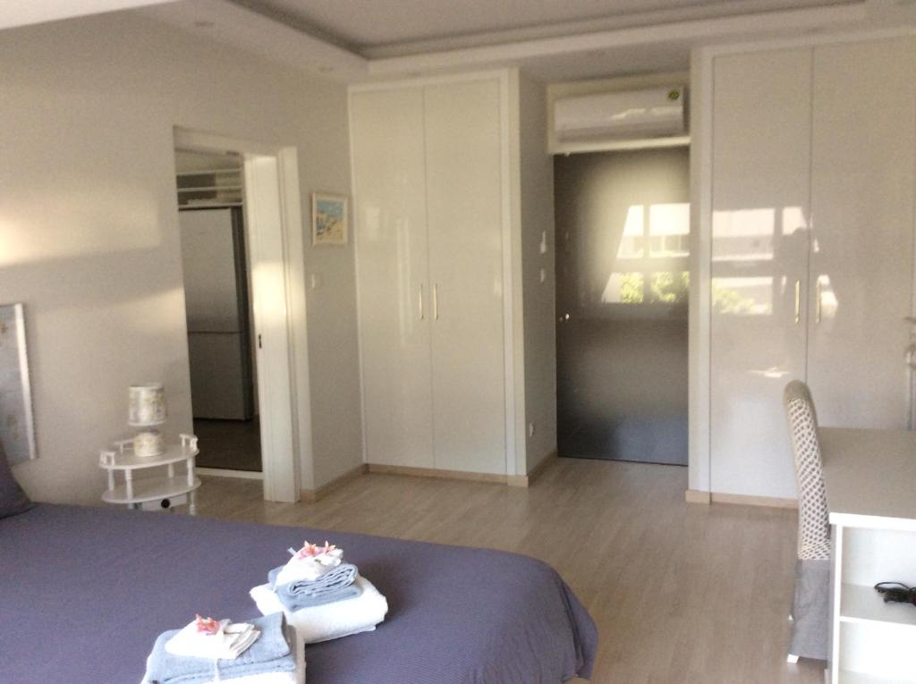 Armonia Suite bedroom with fitted wardrobes and bright natural light, central Nicosia